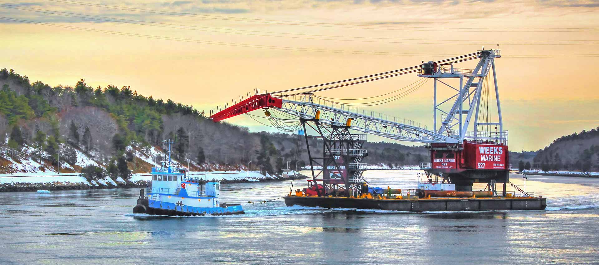 tug-boat-towing-a-crane
